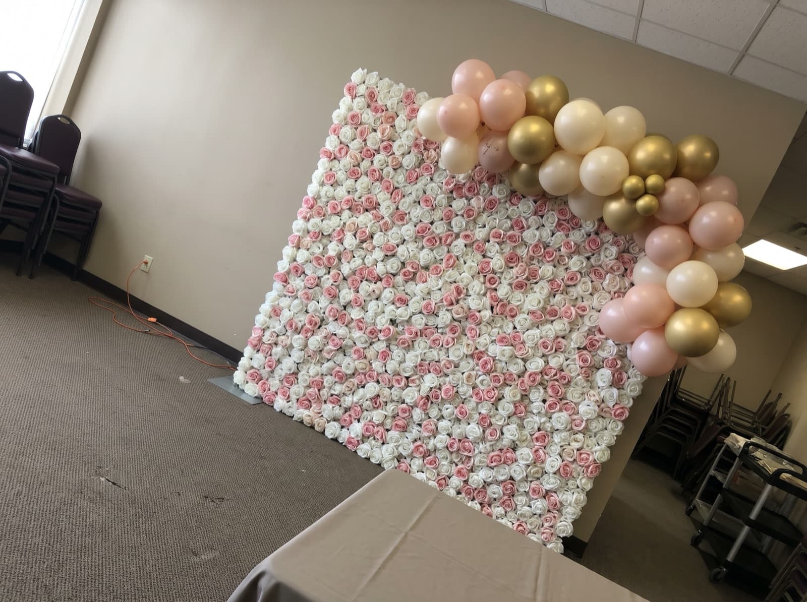 Flower wall backdrop with blush balloons