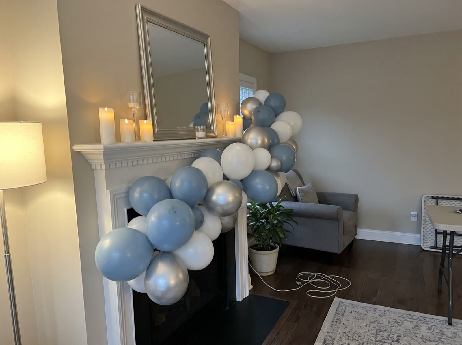 Organic balloon garland along a white mantel