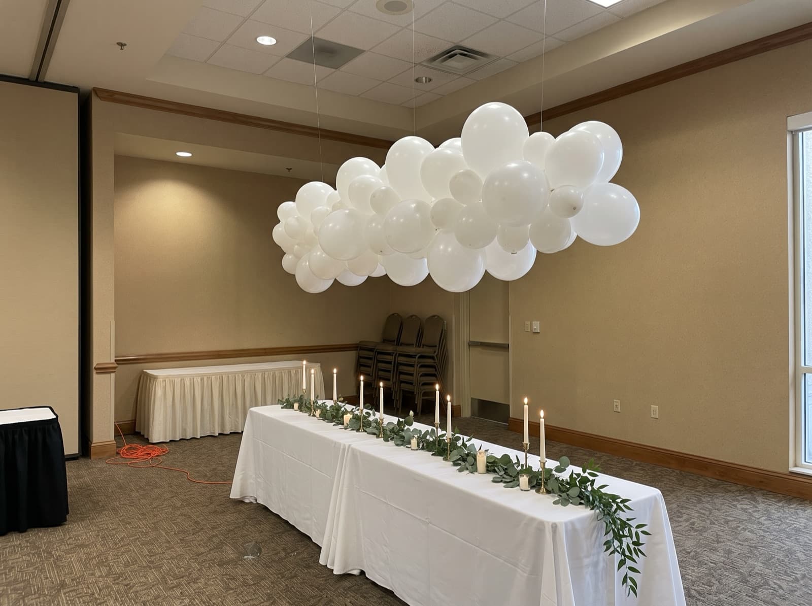 Balloon cloud over a sweetheart table