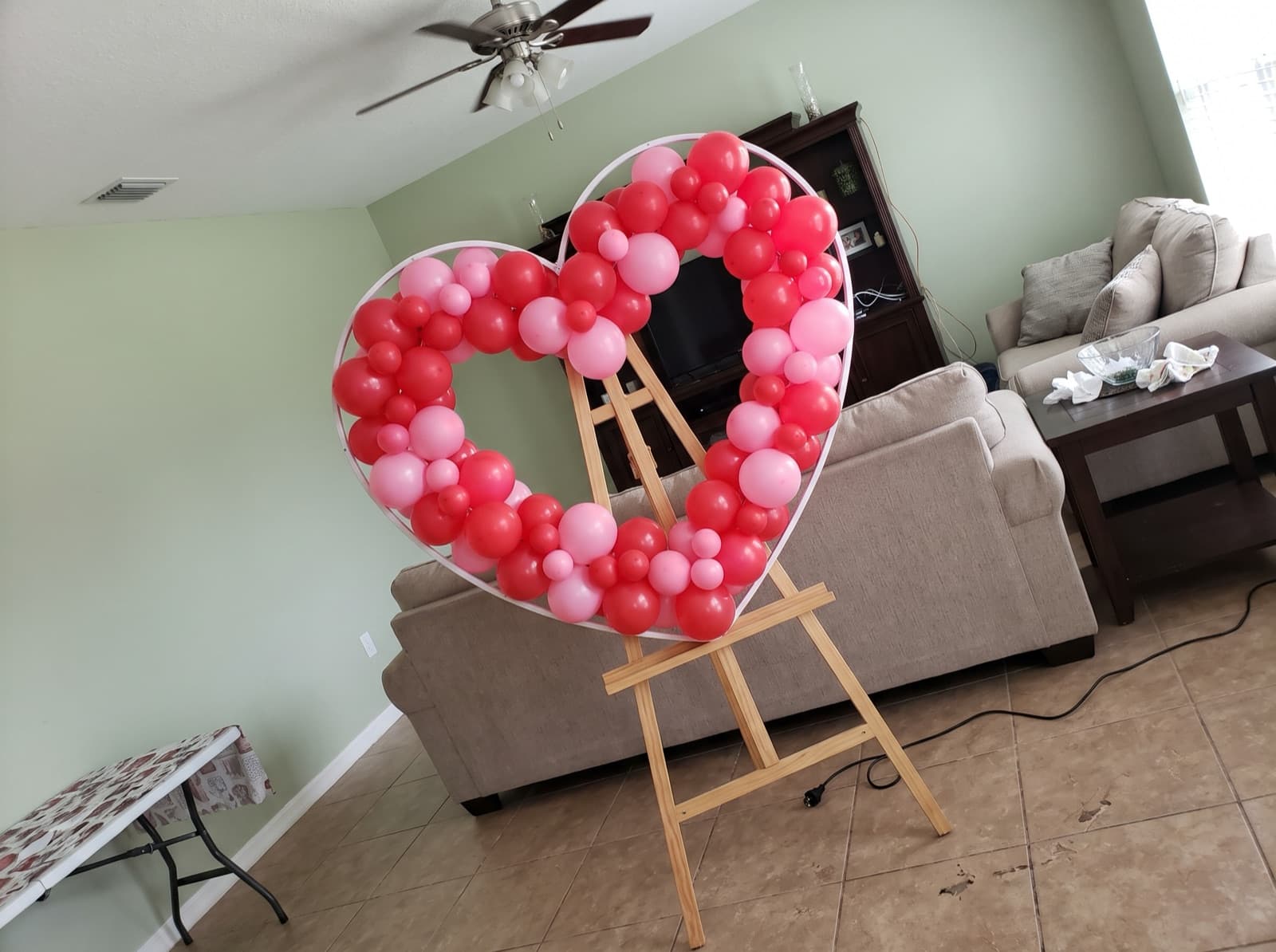 Heart-shaped balloon mosaic in red and pink