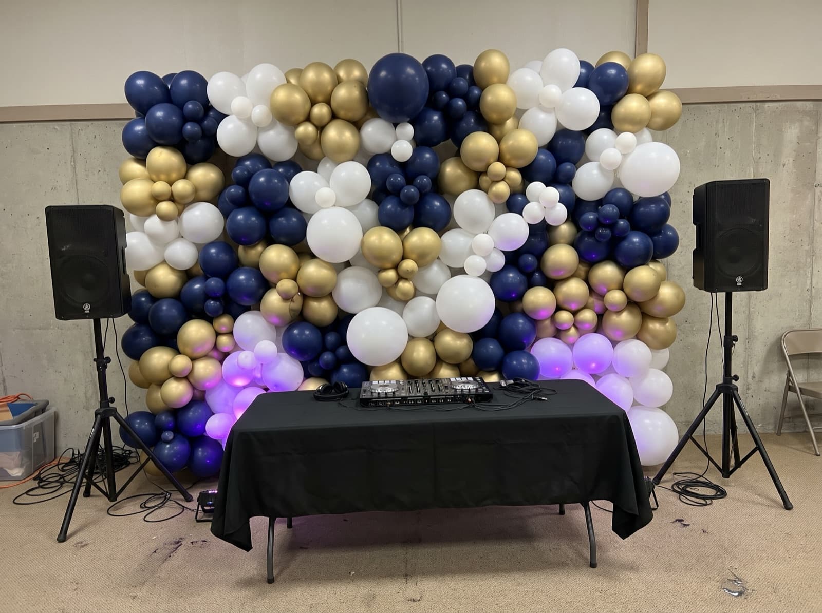 Balloon wall behind a DJ table