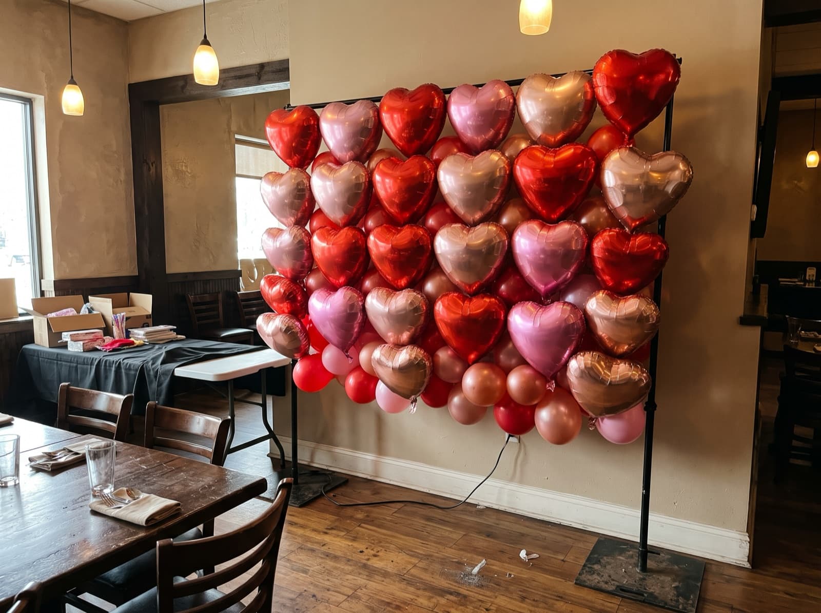 Foil heart balloon wall in red, pink and rose gold